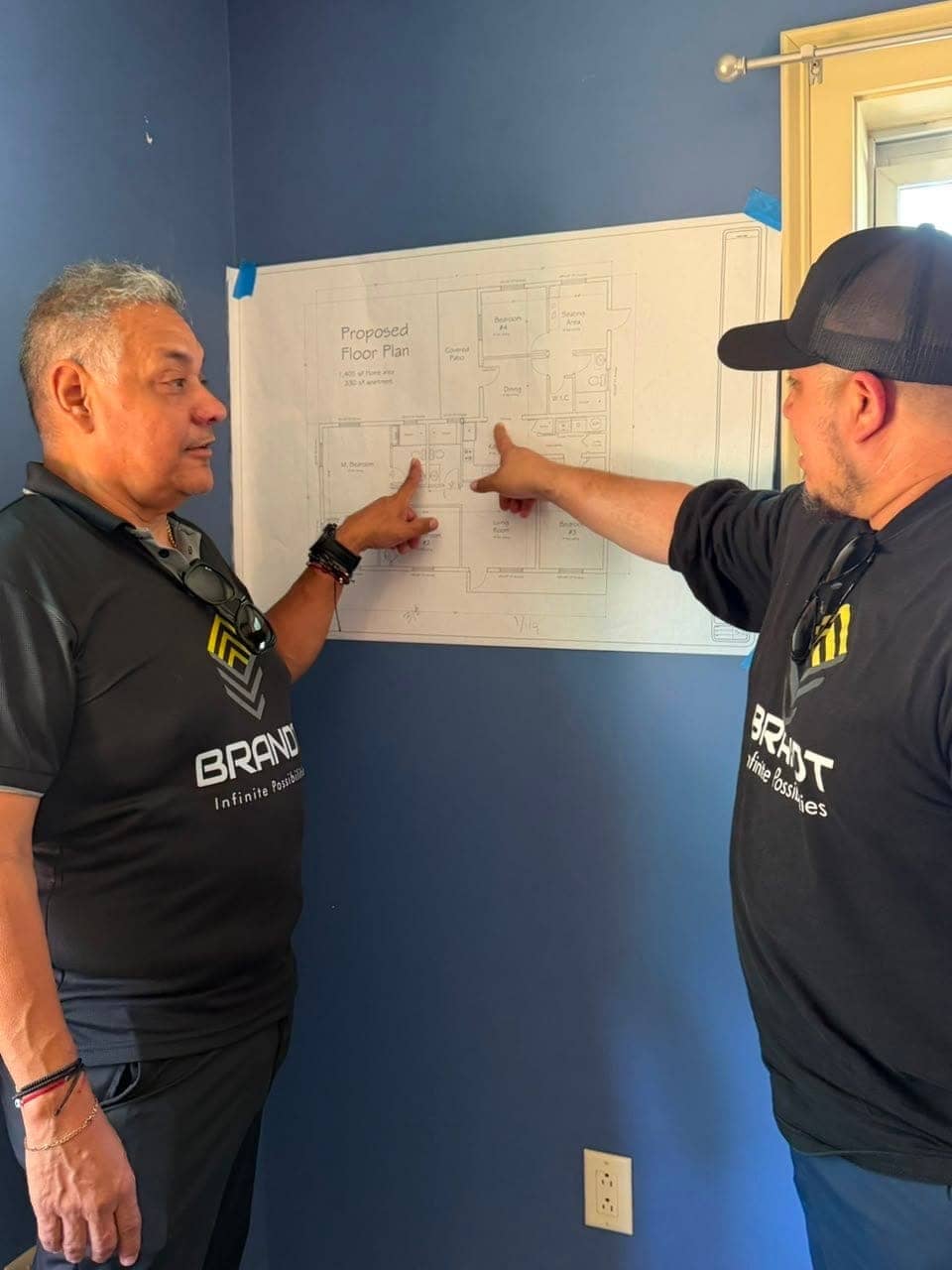 Team reviewing a proposed floor plan